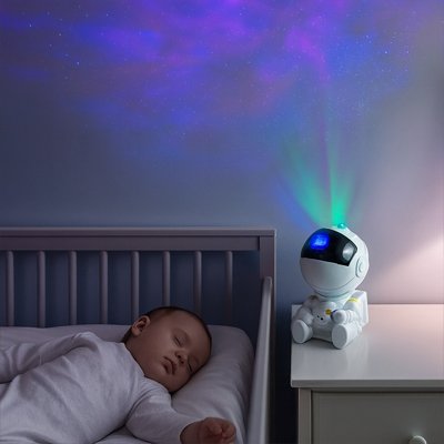 veilleuse bébé projection astronaute sur table chevet berceau enfant endormi